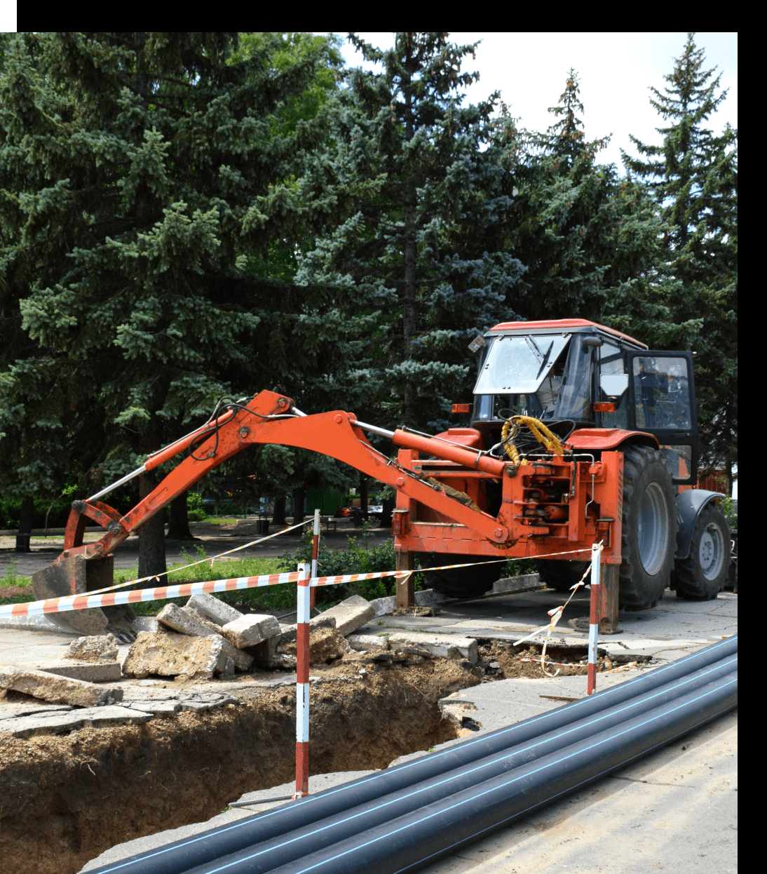 Excavator working on road construction site.